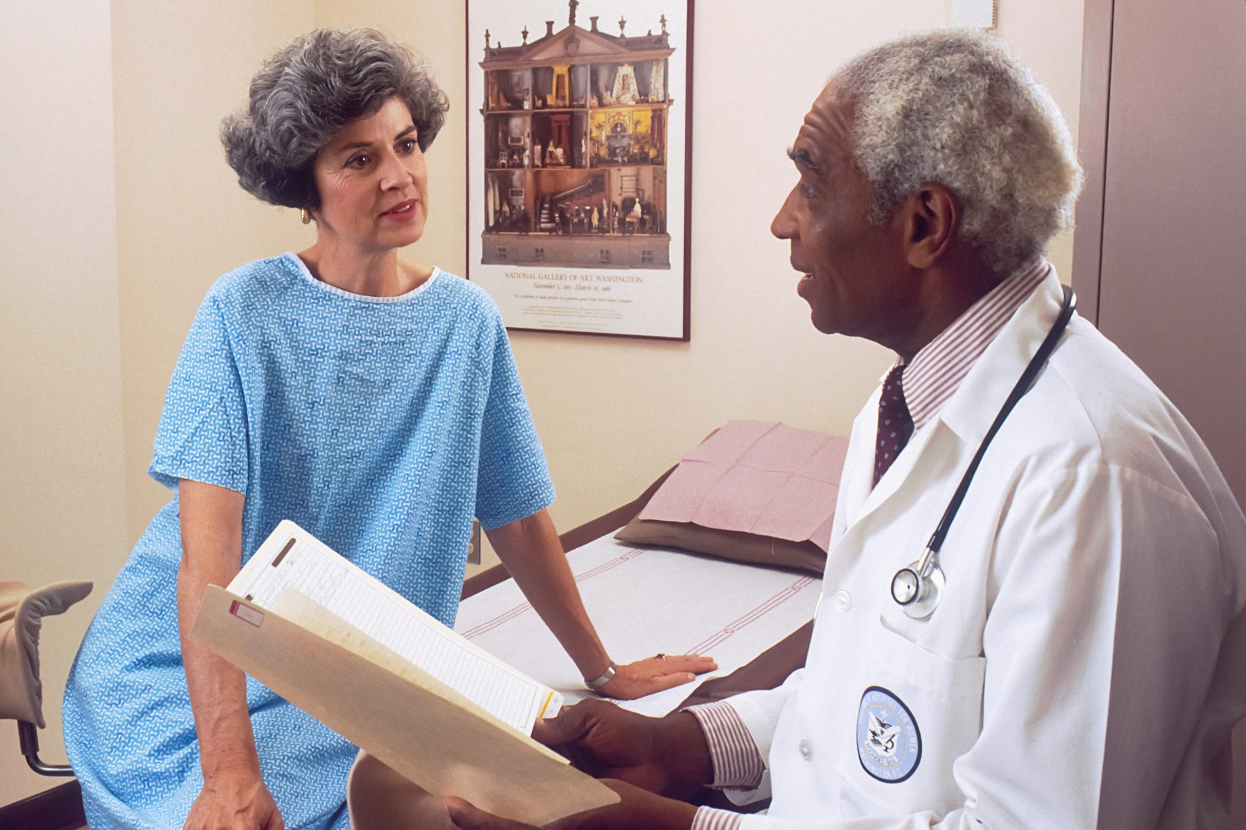 Primary care physician consulting with patient in gatekeeping healthcare system